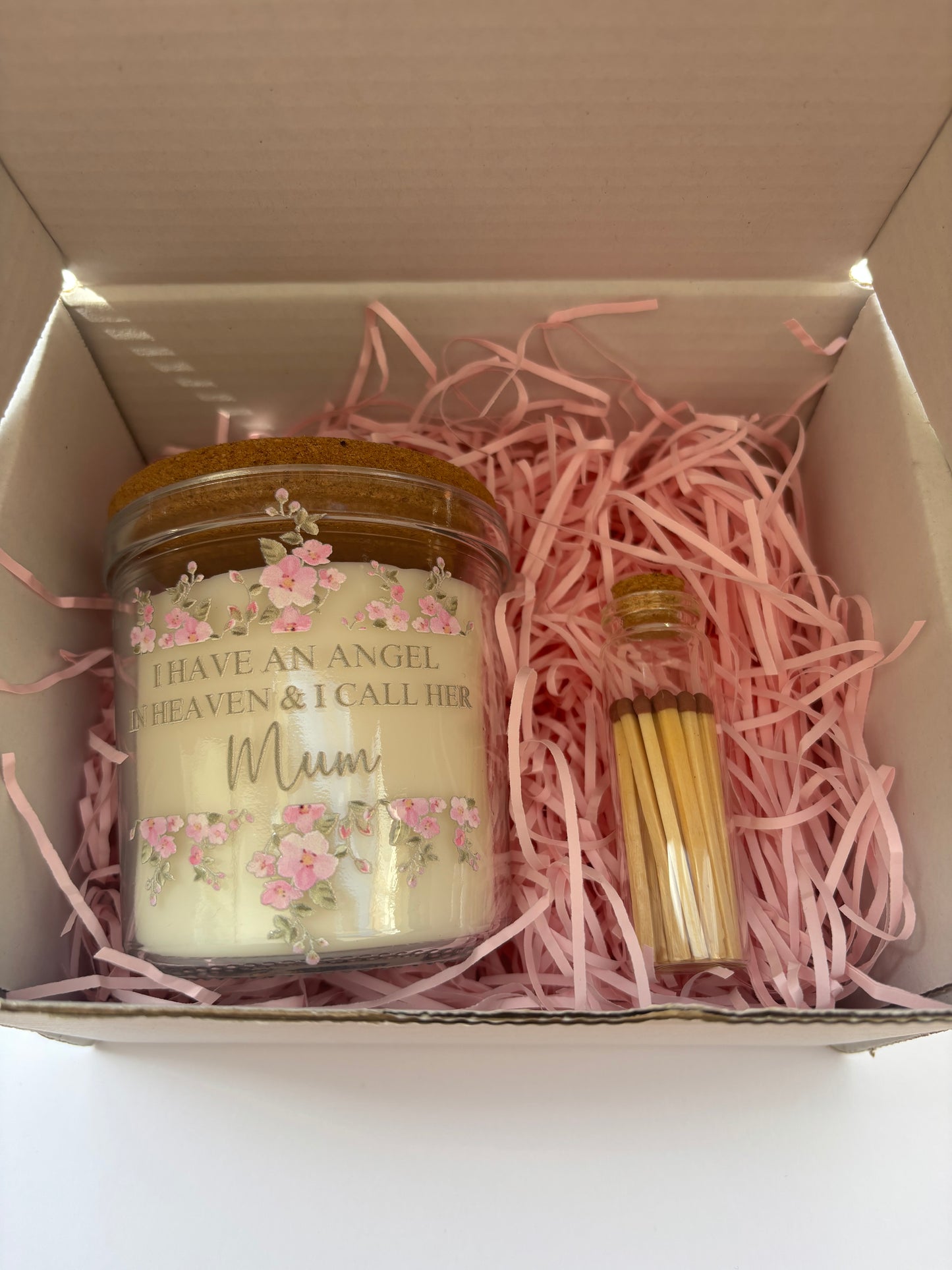 Candle in a box with pink decorative elements