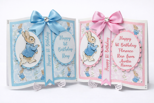 Two birthday cards with Peter Rabbit illustrations and ribbons on a white background