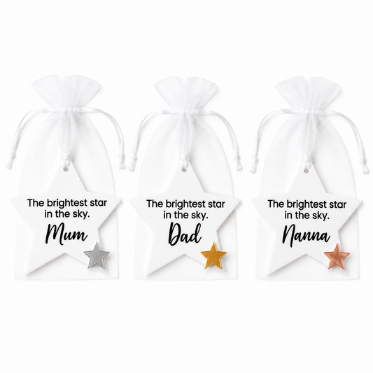 Three white drawstring bags with stars and personalized text on a white background
