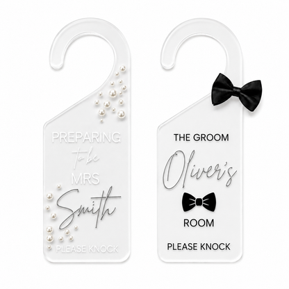 Two personalized white plastic door hangers shown side by side on a white background. The left hanger is for 'Preparing to be Mrs.