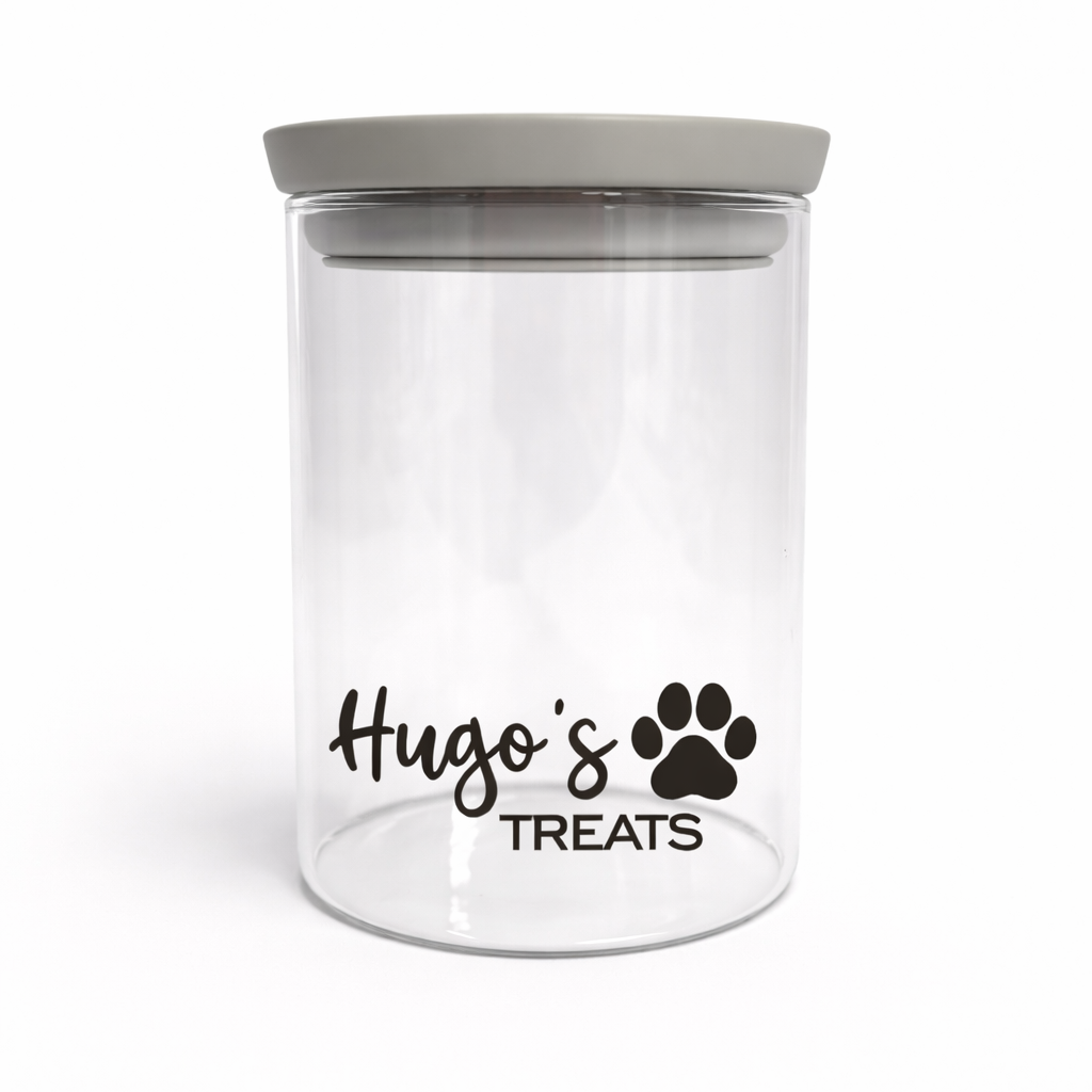 Clear treat jar with gray lid and 'Hugo's Treats' text on a white background