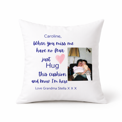 White pillow with personalized message and photo of a woman and child, on a white background