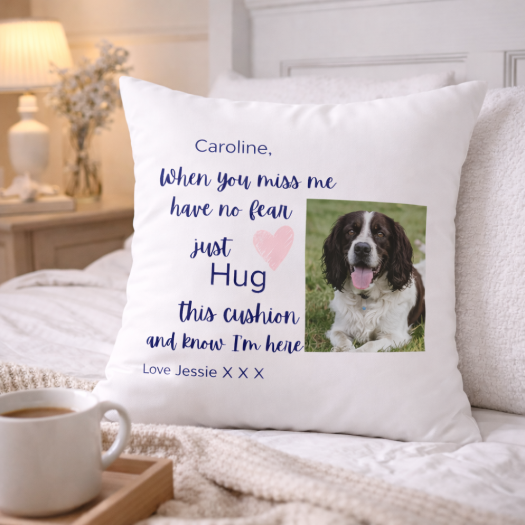 Personalized pillow with a dog photo and message on a bed with a cup of coffee.