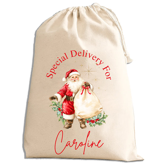 Beige drawstring bag with Santa Claus illustration and text 'Special Delivery For Caroline' on a white background
