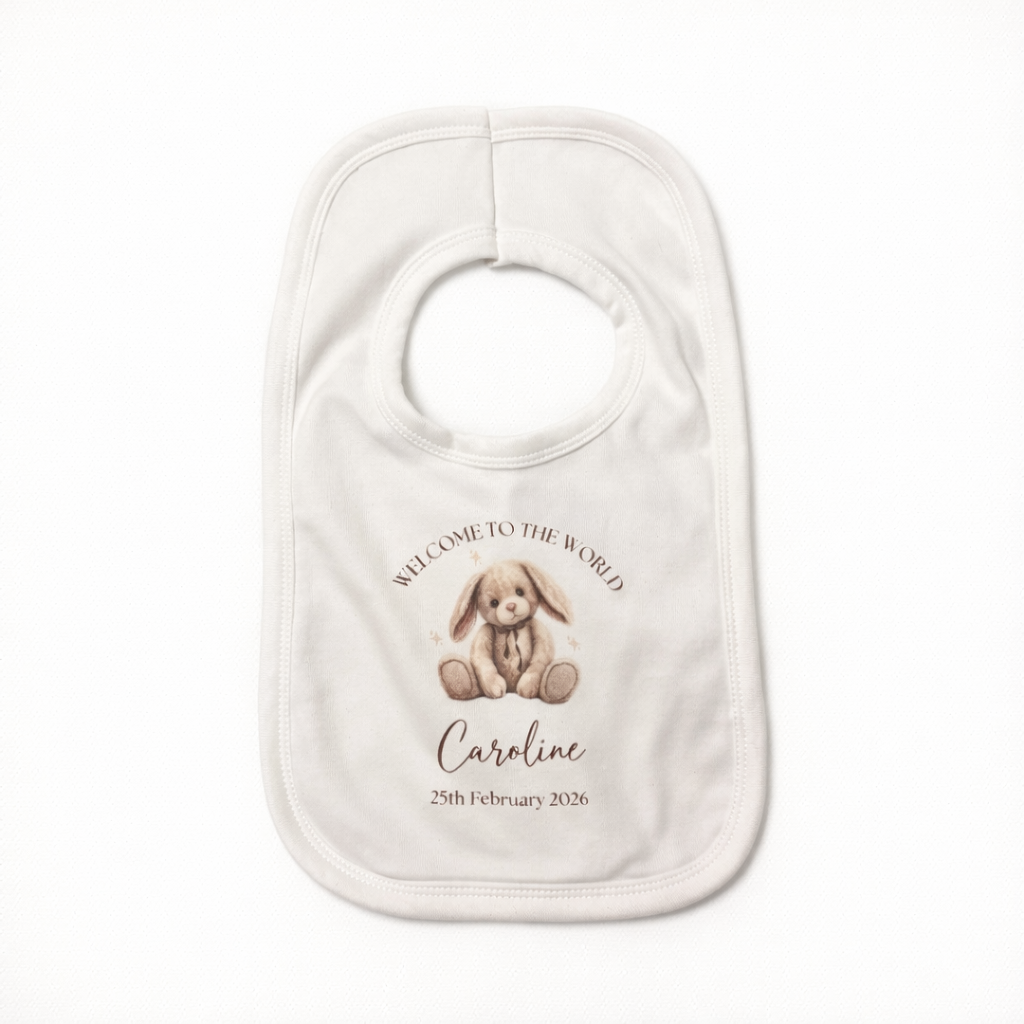Baby bib with a printed design of a bunny and text on a white background