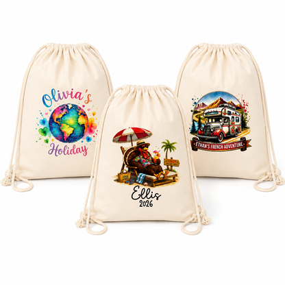 Three cream-colored drawstring backpacks shown on a white background, each with a different colorful printed design. The designs include a watercolor globe with the text 'Olivia's Holiday', a beach scene with the text 'Ellis 2026', and a retro camper van travel scene with the text 'Ellen's French Adventure'.