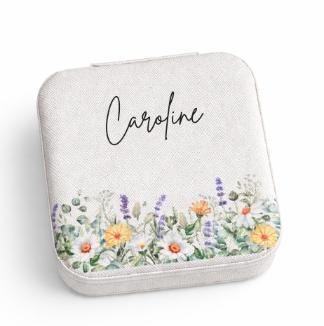 Jewelry box with floral design and 'Caroline' text on a white background