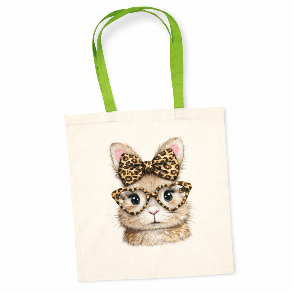 Tote bag with a bunny illustration wearing glasses and a leopard print bow, green handles.