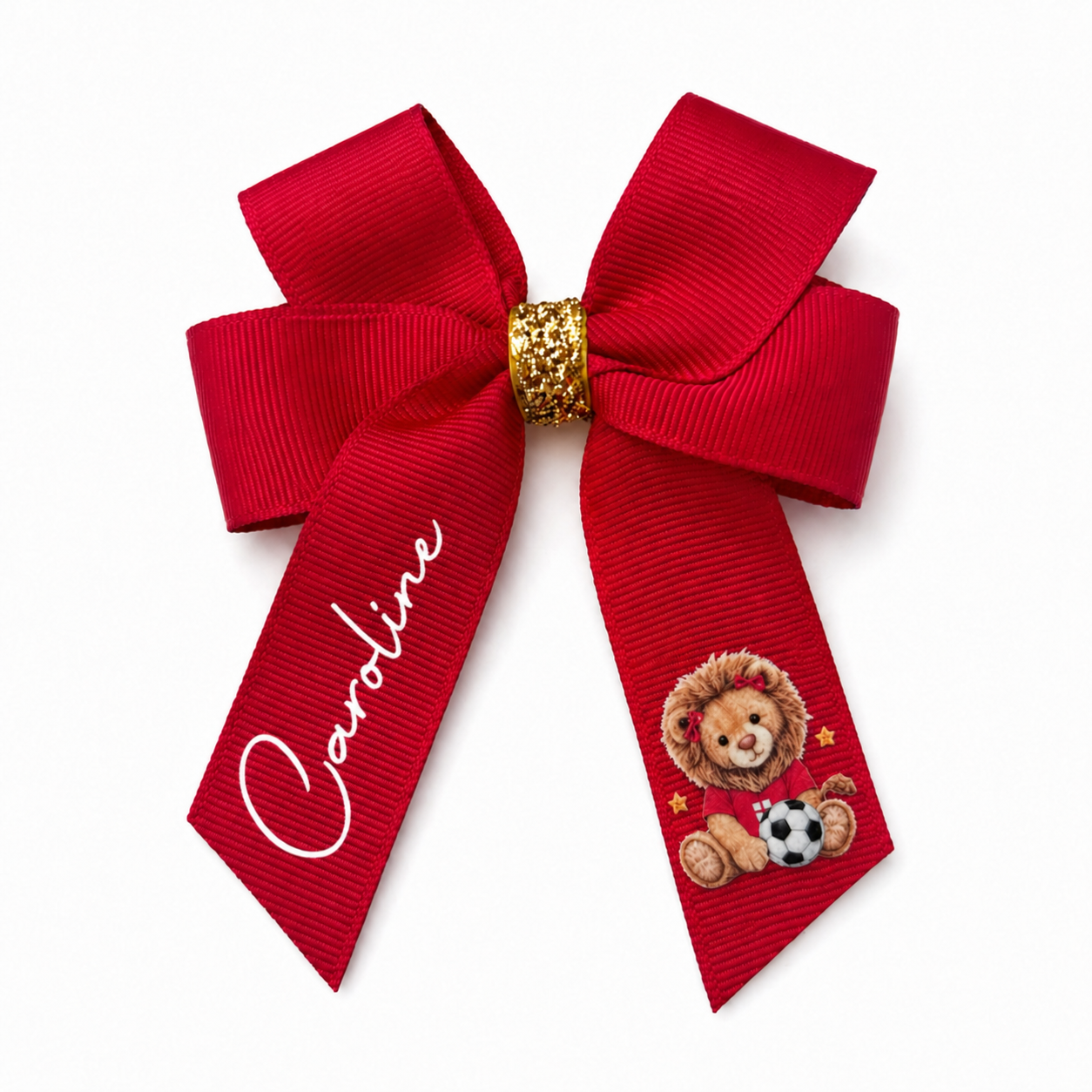 Red bow with gold center and teddy bear design on a white background