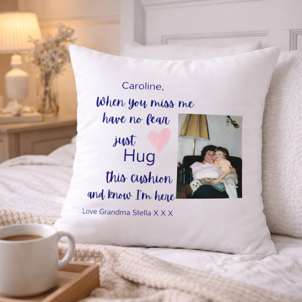 Personalized pillow with photo and message on a bed with coffee and tray.