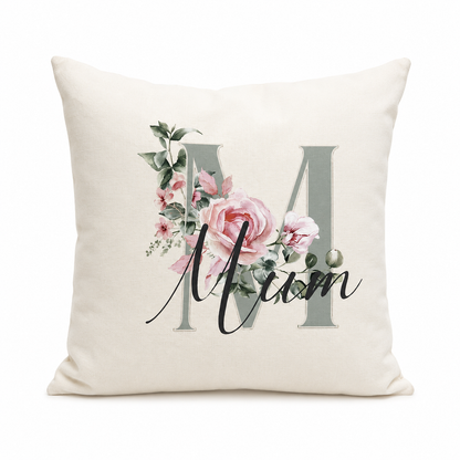 Decorative pillow with floral design and 'Mum' text on a white background