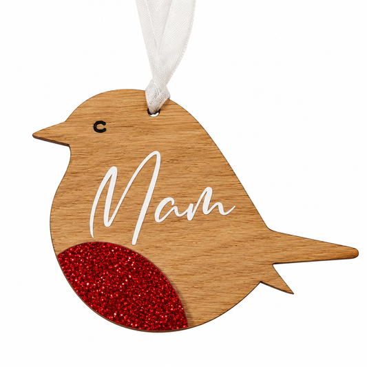 A wooden bird-shaped hanging ornament with a white hanging ribbon, featuring the word 'Mam' in white script and a textured red glitter belly, shown on a plain white background.