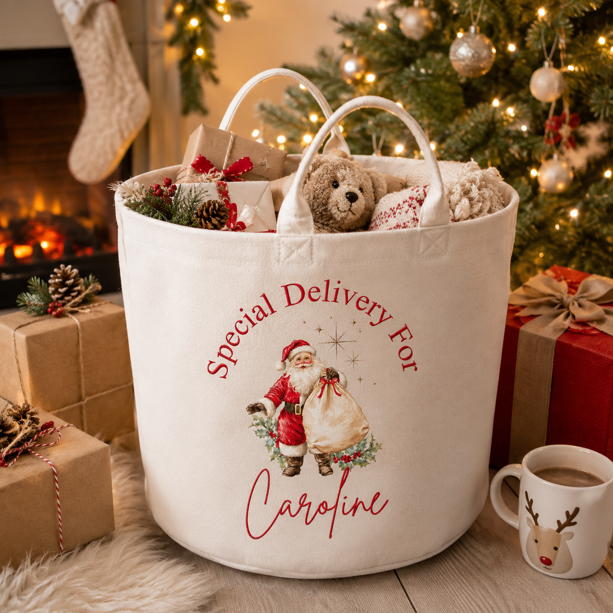 White gift basket with 'Special Delivery For Caroline' text and Santa Claus design, surrounded by Christmas decorations.