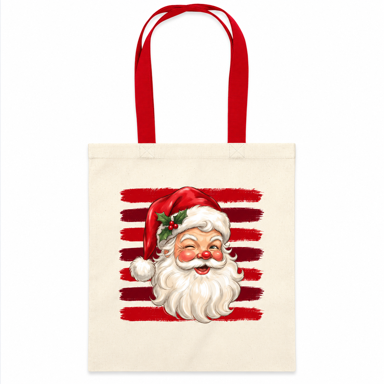 A cream canvas tote bag with red handles, featuring a graphic print of a smiling Santa Claus face in front of red horizontal brushstroke stripes.