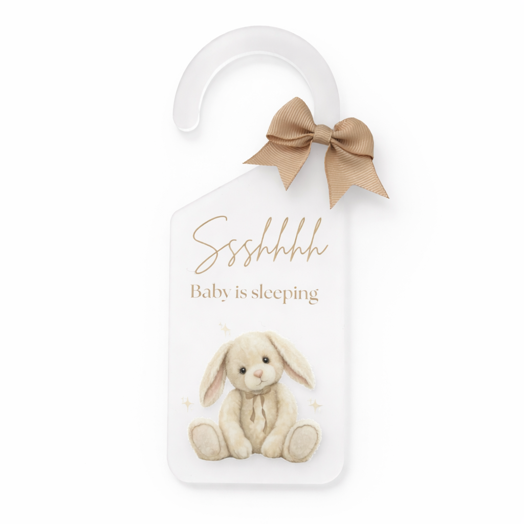 Door hanger with a bunny illustration and 'Baby is sleeping' text on a white background